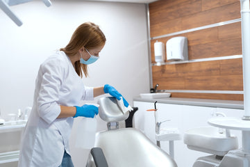 A dentist cleaning the modern dental chair